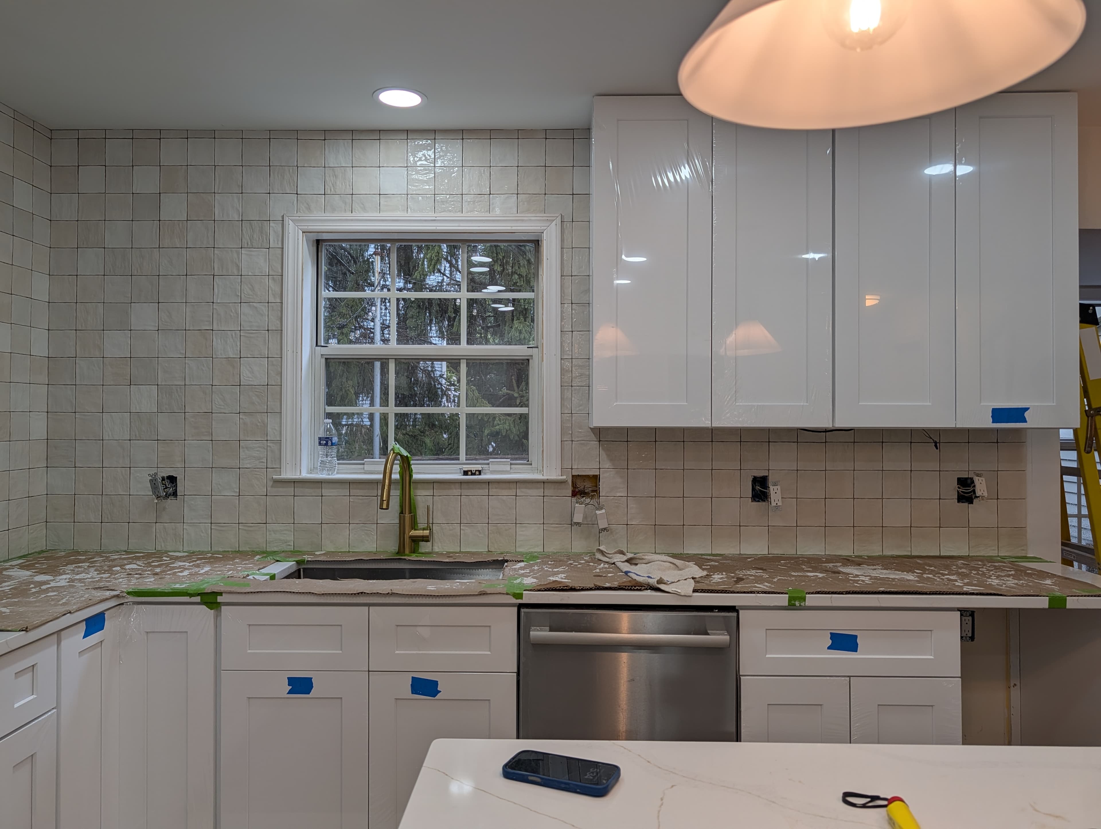 New Herndon kitchen in progress (second project), gas cooktop installed with tile backsplash behind it